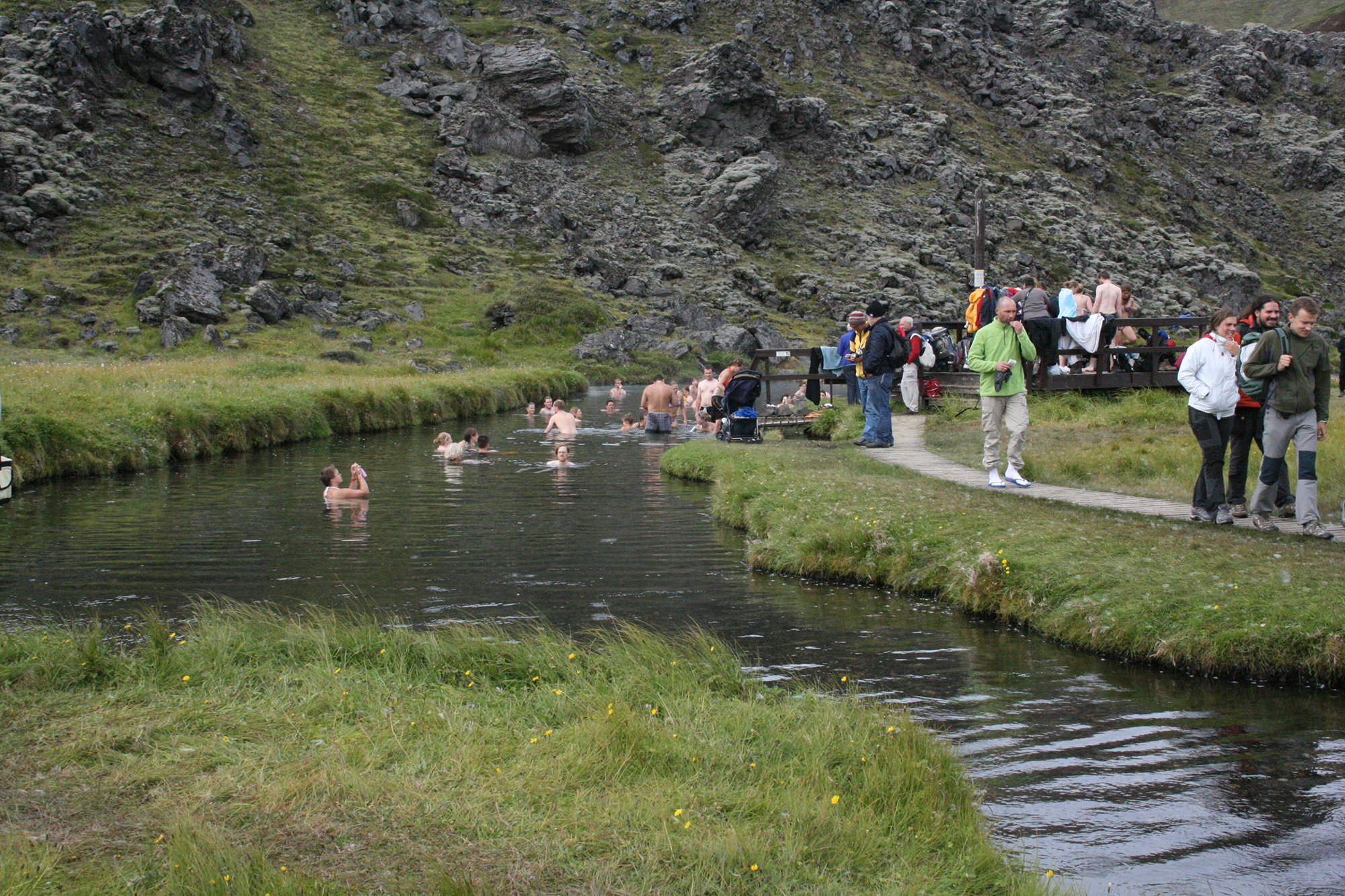 Landmannalaugar Day Tour - Travellers Basking In The Geothermal Waters Of LanDmannalaugar